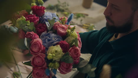 Florist-Collects-Bouquet-and-Looks-at-Camera